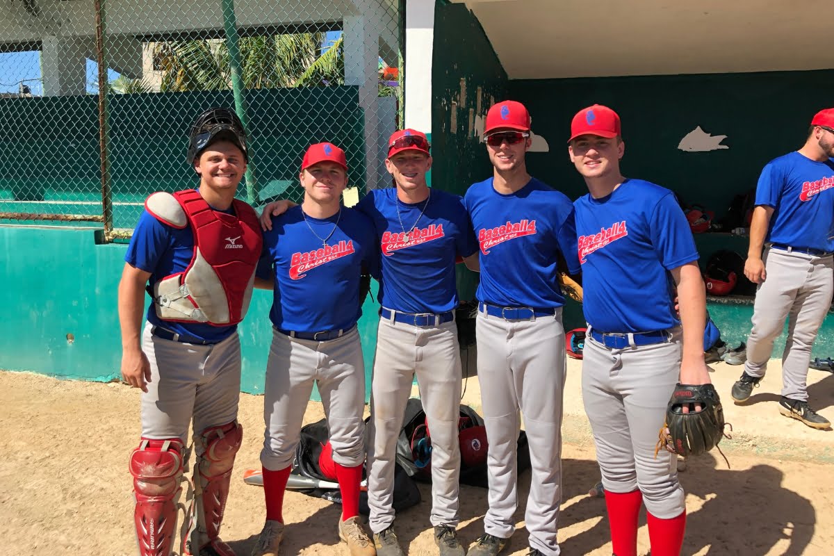 A group of baseball players posing for an event picture.