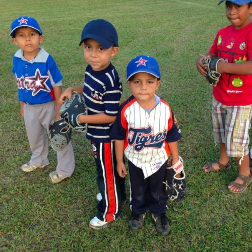 The boys are wearing baseball hats.